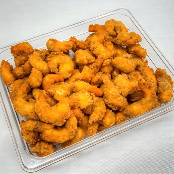A clear plastic container filled with golden-brown, crispy fried shrimp from John's Deli.